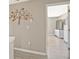 Hallway with wall decor leading into a room with modern furnishings at 384 Parc River Blvd, Lawrenceville, GA 30046