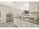 Bright kitchen with white cabinetry, hardwood floors, and stainless steel appliances at 384 Parc River Blvd, Lawrenceville, GA 30046