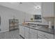 Open-concept kitchen with sleek countertops and stainless steel sink at 384 Parc River Blvd, Lawrenceville, GA 30046
