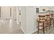 Open kitchen featuring a breakfast bar with seating, hardwood floors, and bright, open space at 384 Parc River Blvd, Lawrenceville, GA 30046