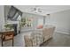 Cozy living room with fireplace, large screen television and natural light at 384 Parc River Blvd, Lawrenceville, GA 30046