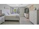 Cozy main bedroom featuring natural light, modern décor, and white furniture at 384 Parc River Blvd, Lawrenceville, GA 30046