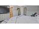 This main bedroom features a large dresser, mirror, and access to the main bathroom at 384 Parc River Blvd, Lawrenceville, GA 30046