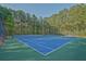 Close up view of the community's tennis court with a green and blue surface at 384 Parc River Blvd, Lawrenceville, GA 30046
