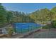 Enjoy the outdoors on the community's tennis courts, surrounded by trees and greenery at 384 Parc River Blvd, Lawrenceville, GA 30046