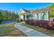 Landscaped walkway leading to the community clubhouse, surrounded by lush greenery at 384 Parc River Blvd, Lawrenceville, GA 30046