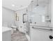 Luxurious bathroom features tiled shower, soaking tub, modern fixtures, and vanity with marble countertop at 915 John Ward Rd, Marietta, GA 30064
