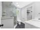 Bathroom featuring a glass enclosed shower with decorative marble tile and a modern vanity at 915 John Ward Rd, Marietta, GA 30064