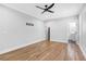 Spacious bedroom featuring hardwood floors, a ceiling fan, and access to a connected bathroom at 915 John Ward Rd, Marietta, GA 30064