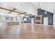 Spacious living room with hardwood floors, high ceilings, exposed wood beams, and a modern fireplace at 915 John Ward Rd, Marietta, GA 30064