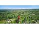 Property aerial showing large lot size, mature trees, and proximity to surrounding landscape at 655 Poplar Rd, Dallas, GA 30157
