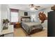 Comfortable bedroom with a cozy bed, ceiling fan and soft carpet at 655 Poplar Rd, Dallas, GA 30157
