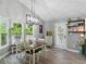 Bright dining room with vaulted ceiling, hardwood floors, and lots of natural light at 655 Poplar Rd, Dallas, GA 30157