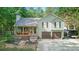 Charming home with a covered porch and well-maintained landscaping on a wooded lot at 655 Poplar Rd, Dallas, GA 30157