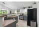 Modern kitchen with stainless steel appliances, gray cabinets, and stylish lighting at 655 Poplar Rd, Dallas, GA 30157
