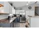 Well-lit kitchen featuring stainless steel appliances, a breakfast bar, and ample cabinet space at 655 Poplar Rd, Dallas, GA 30157