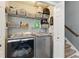 Efficient laundry area with organized shelving and modern, front-loading washer and dryer at 655 Poplar Rd, Dallas, GA 30157