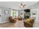 Comfortable living room featuring natural light, a stone fireplace, and hardwood floors at 655 Poplar Rd, Dallas, GA 30157
