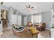 Bright living room with hardwood floors, neutral paint, and staircase access at 655 Poplar Rd, Dallas, GA 30157