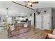 Open-concept living room with a vaulted ceiling, dining area, and hardwood floors at 655 Poplar Rd, Dallas, GA 30157