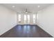 Bright living room featuring hardwood floors, recessed lighting, and a ceiling fan at 109 Iveybrooke Ln # 59, Alpharetta, GA 30009