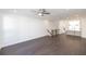 Open-concept living space with hardwood floors, recessed lighting, and a view to kitchen at 109 Iveybrooke Ln # 59, Alpharetta, GA 30009