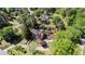 Idyllic setting featuring a well-maintained home, swimming pool, outbuildings, and surrounding mature trees at 2405 Old Salem Se Rd, Conyers, GA 30013
