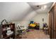 Attic space with light colored walls, a sloped ceiling, and carpet at 2405 Old Salem Se Rd, Conyers, GA 30013