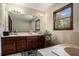 Bathroom featuring a double sink vanity with ample storage, a blue rug, and plenty of light at 2405 Old Salem Se Rd, Conyers, GA 30013