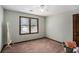 Bedroom with neutral carpet, a ceiling fan, and a large window allowing for great natural light at 2405 Old Salem Se Rd, Conyers, GA 30013