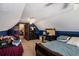 Attic bedroom features blue accent walls, carpet, and a dormer window at 2405 Old Salem Se Rd, Conyers, GA 30013