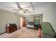 A comfortable bedroom offering natural light, a ceiling fan, and neutral walls and carpet at 2405 Old Salem Se Rd, Conyers, GA 30013