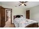Bedroom features carpet, two doors, a ceiling fan, and neutral colored walls at 2405 Old Salem Se Rd, Conyers, GA 30013