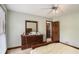 Bedroom offering a large dresser, a ceiling fan, and neutral carpet and walls at 2405 Old Salem Se Rd, Conyers, GA 30013