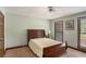 Bedroom with neutral carpet, windows and a bed that offers a comfortable sleep experience at 2405 Old Salem Se Rd, Conyers, GA 30013