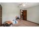 Spacious bedroom with ceiling fan, neutral carpet, a doorway to another room and large closet at 2405 Old Salem Se Rd, Conyers, GA 30013