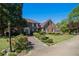 Charming two-story brick home featuring a well-manicured lawn and mature landscaping at 2405 Old Salem Se Rd, Conyers, GA 30013