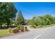 Beautiful suburban home features mature landscaping, a circular driveway, and a brick facade at 2405 Old Salem Se Rd, Conyers, GA 30013