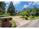 Charming home featuring a circular driveway, mature trees, and a well-maintained front yard, creating a welcoming entrance at 2405 Old Salem Se Rd, Conyers, GA 30013