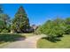 Beautiful home with manicured lawn, mature trees, and a winding driveway, offering great curb appeal at 2405 Old Salem Se Rd, Conyers, GA 30013