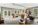Large open living room area with many windows and french doors to the outside at 2405 Old Salem Se Rd, Conyers, GA 30013