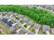 Aerial view of a home in established community with mature landscaping, property lines marked at 4395 Wildbrooke Pkwy, Cumming, GA 30041