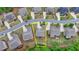 Bird's eye view of a single Gathering home in a suburban neighborhood, tree-lined streets at 4395 Wildbrooke Pkwy, Cumming, GA 30041