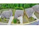 Aerial view showcases the well-defined property boundaries, manicured lawns, mature trees, and proximity to neighborhood at 4395 Wildbrooke Pkwy, Cumming, GA 30041