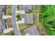 Aerial view of a home in a suburban neighborhood with a private backyard at 4395 Wildbrooke Pkwy, Cumming, GA 30041