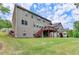 Spacious backyard with a deck, complemented by a green lawn, offers ample room for outdoor enjoyment at 4395 Wildbrooke Pkwy, Cumming, GA 30041
