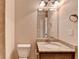 Bathroom features granite countertop, vanity and decorative lighting at 4395 Wildbrooke Pkwy, Cumming, GA 30041