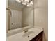 Bright bathroom featuring a vanity with a white countertop and a large mirror at 4395 Wildbrooke Pkwy, Cumming, GA 30041
