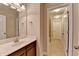 Bright bathroom featuring a vanity with a dark wood cabinet and a tile floor at 4395 Wildbrooke Pkwy, Cumming, GA 30041