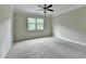 Spacious bedroom with natural light and neutral carpeting at 4395 Wildbrooke Pkwy, Cumming, GA 30041